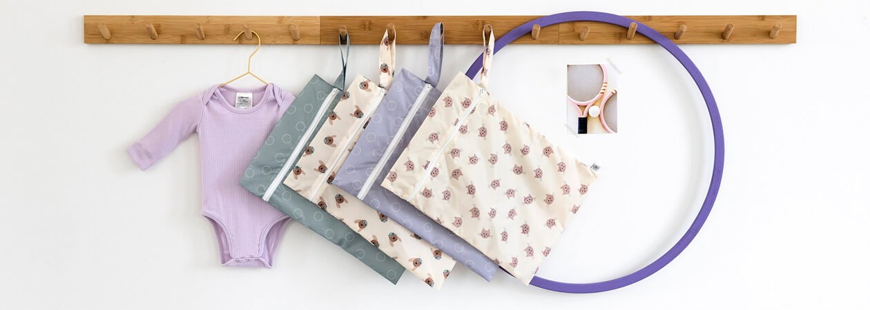 baby clothing, onesie, sleep sack, baby blanket, hula hoop, hanging storage, pastel colors, kid accessories, tote bag, cotton fabric